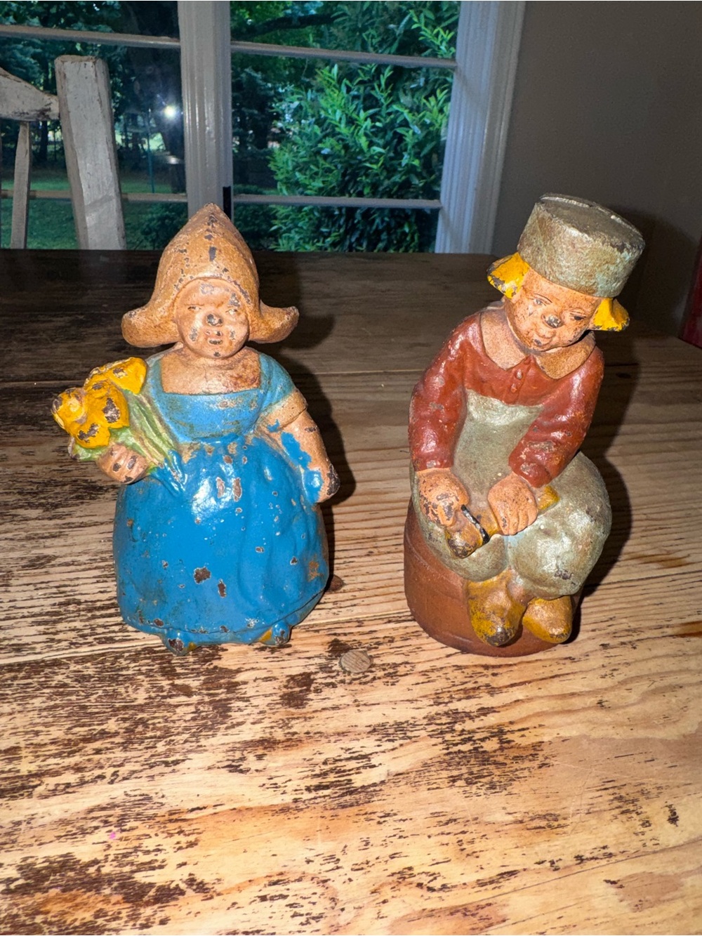 Hubley Cast Iron Still Penny Banks Dutch Boy on Barrel & Girl w/ flowers- 1930's